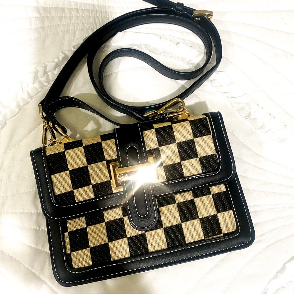 Black and gold checkered pattern crossbody bag.
NEW!
